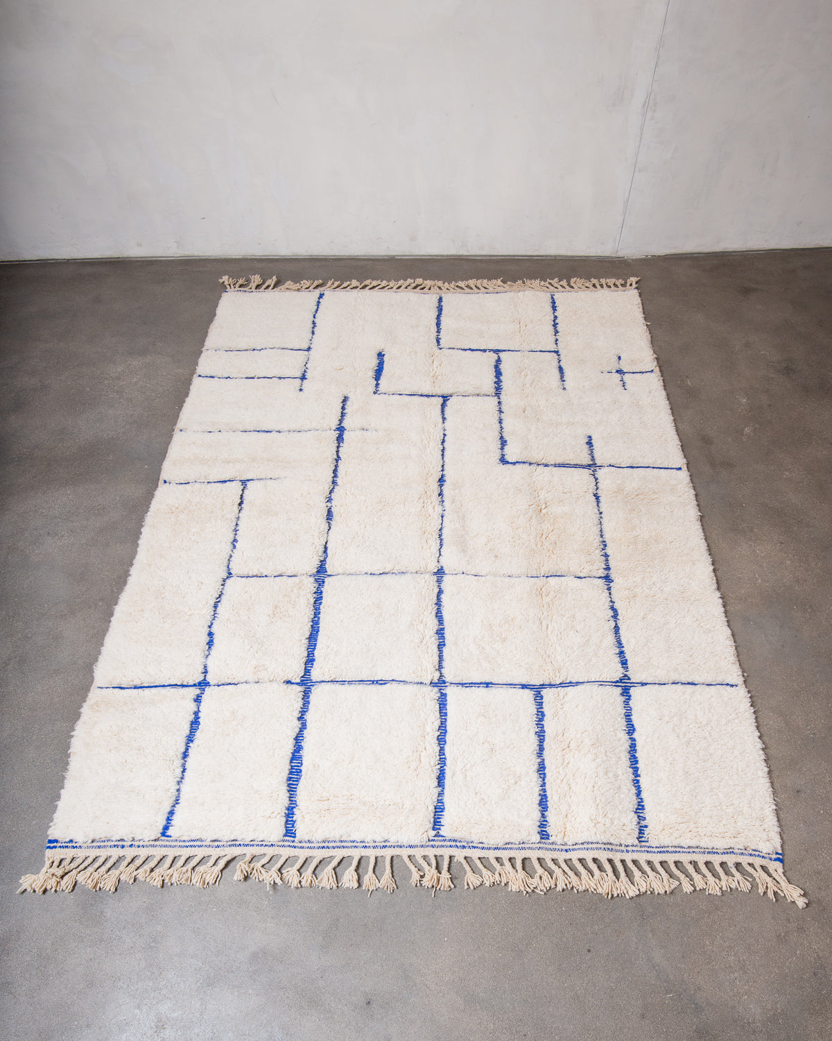 Modern, designer, handcrafted Berber rug from Morocco. Beniourain carpet with beautiful colours and patterns and fluffy wool texture.